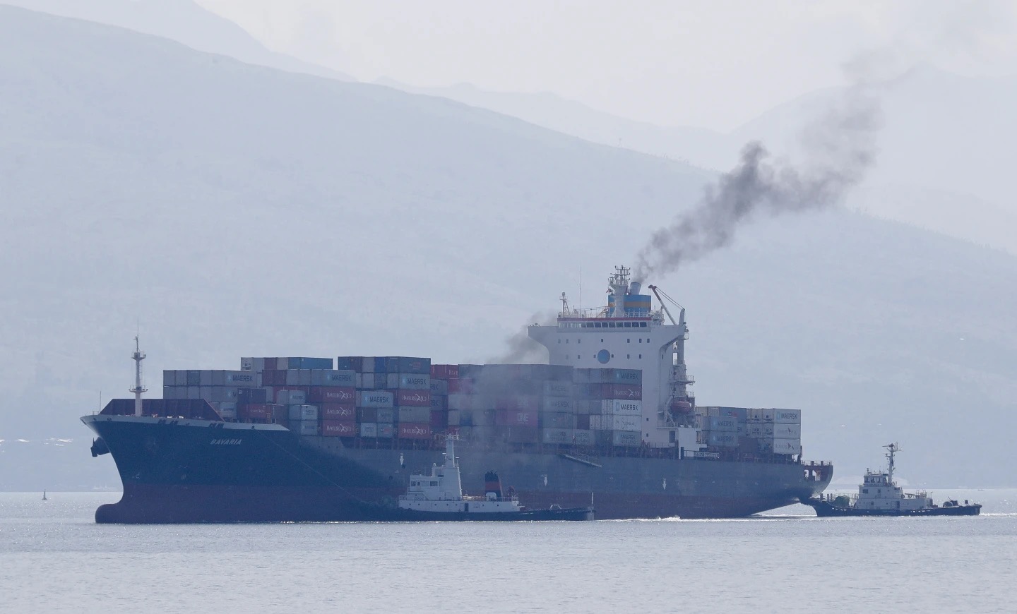 Cargo ship M/V Bavaria is assisted by tug boats as it prepares to dock at Subic port in Zambales province, northwestern Philippines, May 30, 2019. /AP