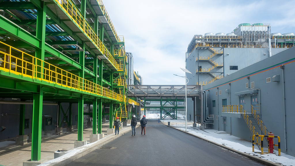 Workers conduct routine check outside of a high-purity crystalline silicon factory in the Nanchuan Industrial Park, Xining City, northwest China's Qinghai Province, February 16, 2023. /CFP