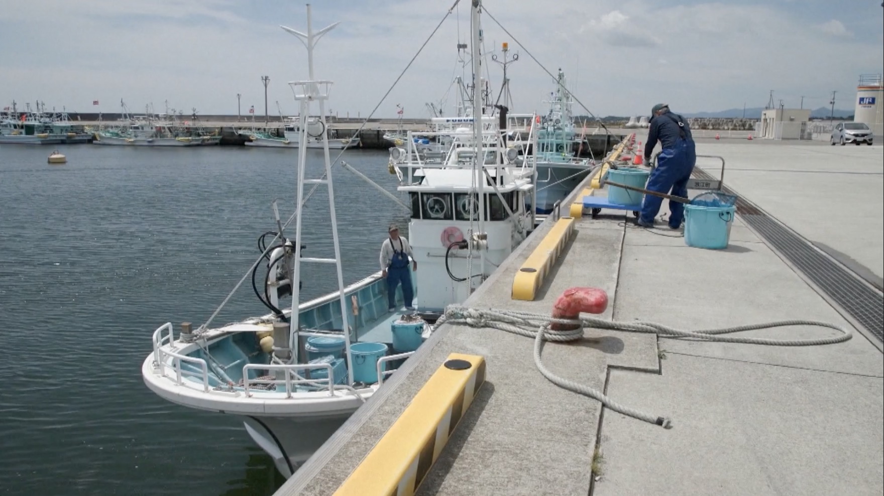 Fishing boats at a harbor in Fukushima, July 3, 2023. /CGTN