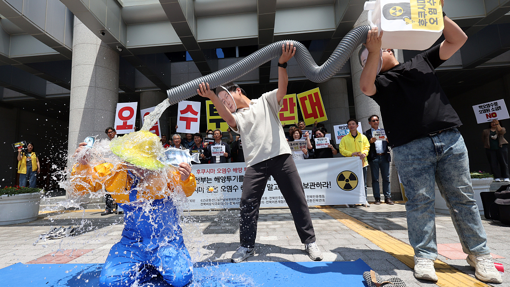 Locals put on a performance to protest against Japan's planned discharge of Fukushima wastewater into the Pacific Ocean, Jeollabuk-do, South Korea, June 8, 2023. /CFP