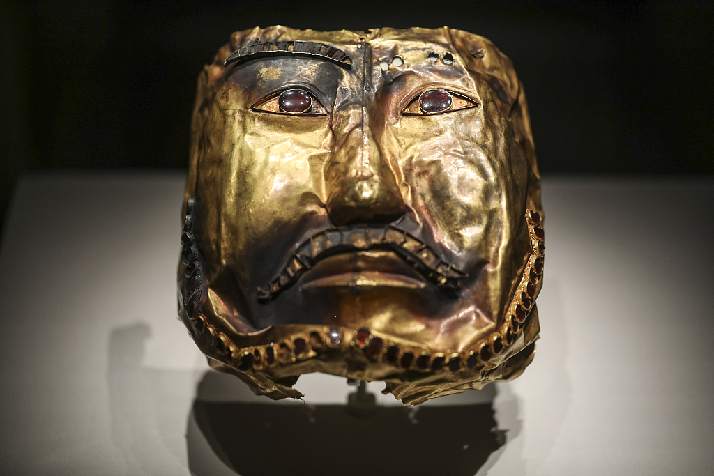 A golden mask embedded with rubies from the Northern Dynasties (386-581) is displayed at a Xinjiang-themed exhibition at the National Museum in Beijing, June 21, 2023. /CFP