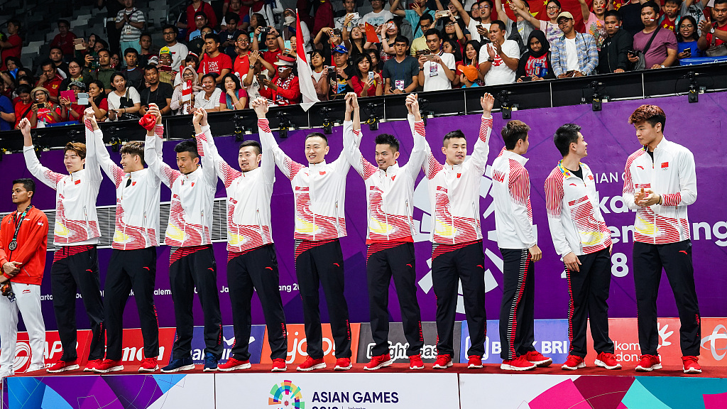 Chinese players celebrate during the men's team event ceremony at 2018 Asian Games in Jakarta, Indonesia. /CFP