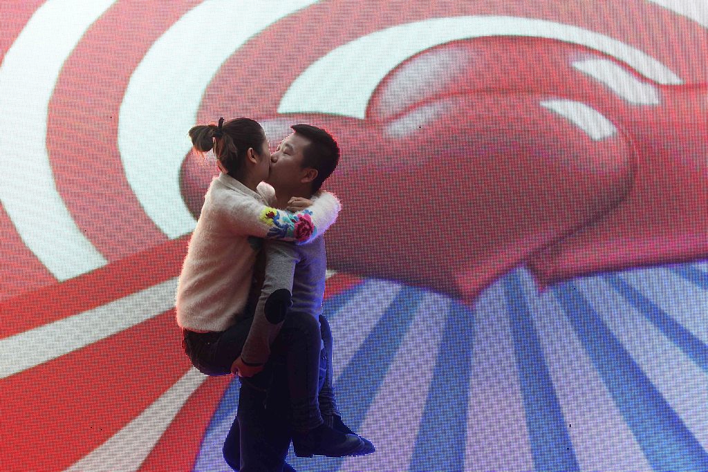 A file photo shows a couple participating in a kissing competition in Xiangyang, Hubei. /CFP