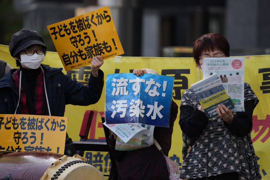 People protest against the Fukushima discharge plan near the headquarters of TEPCO in Tokyo, Japan, March 11, 2023. /Xinhua