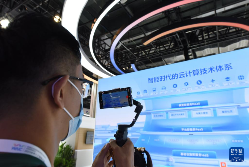 A journalist shooting in the venue of the 2023 World Artificial Intelligence Conference in Shanghai, China, July 5, 2023. /Xinhua