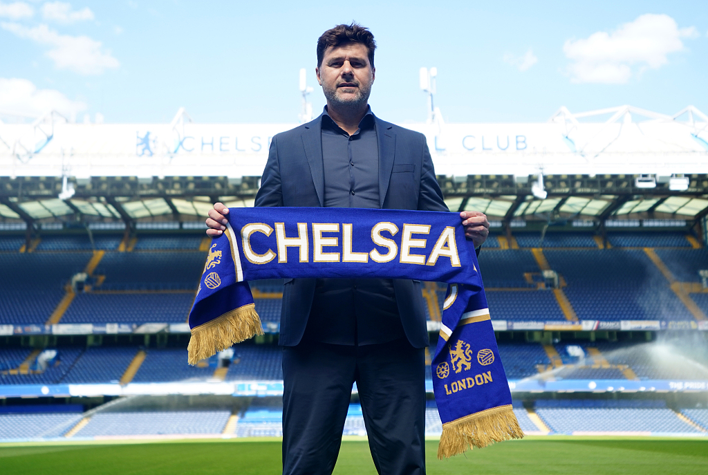 Mauricio Pochettino, manager of Chelsea, poses with the club's scarf at Stamford Bridge in London, England, July 7, 2023. /CFP