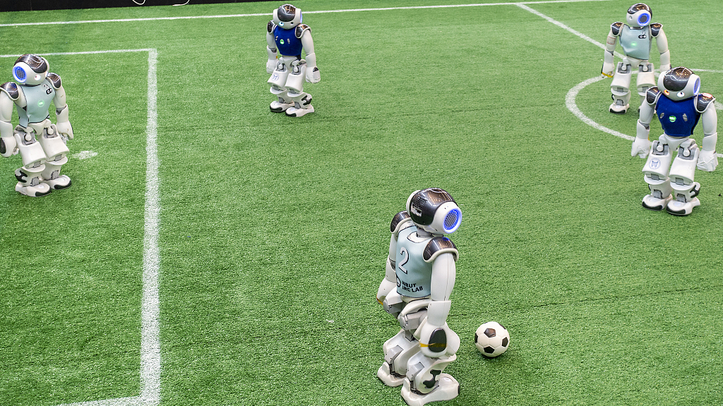 Two robot soccer teams compete at the World Artificial Intelligence Conference held in east China's Shanghai, July 7, 2023. /CFP