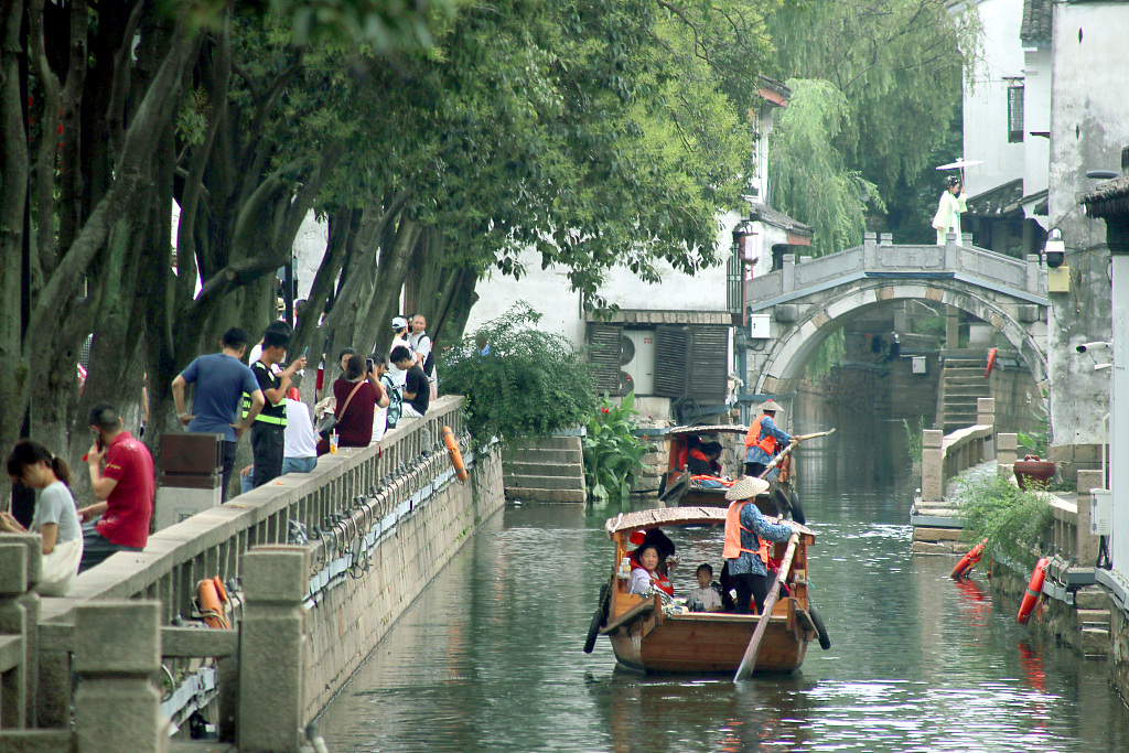 Tourists take a cruise at the Pingjiang historic and cultural block in Suzhou, Jiangsu Province, July 7, 2023. /CFP