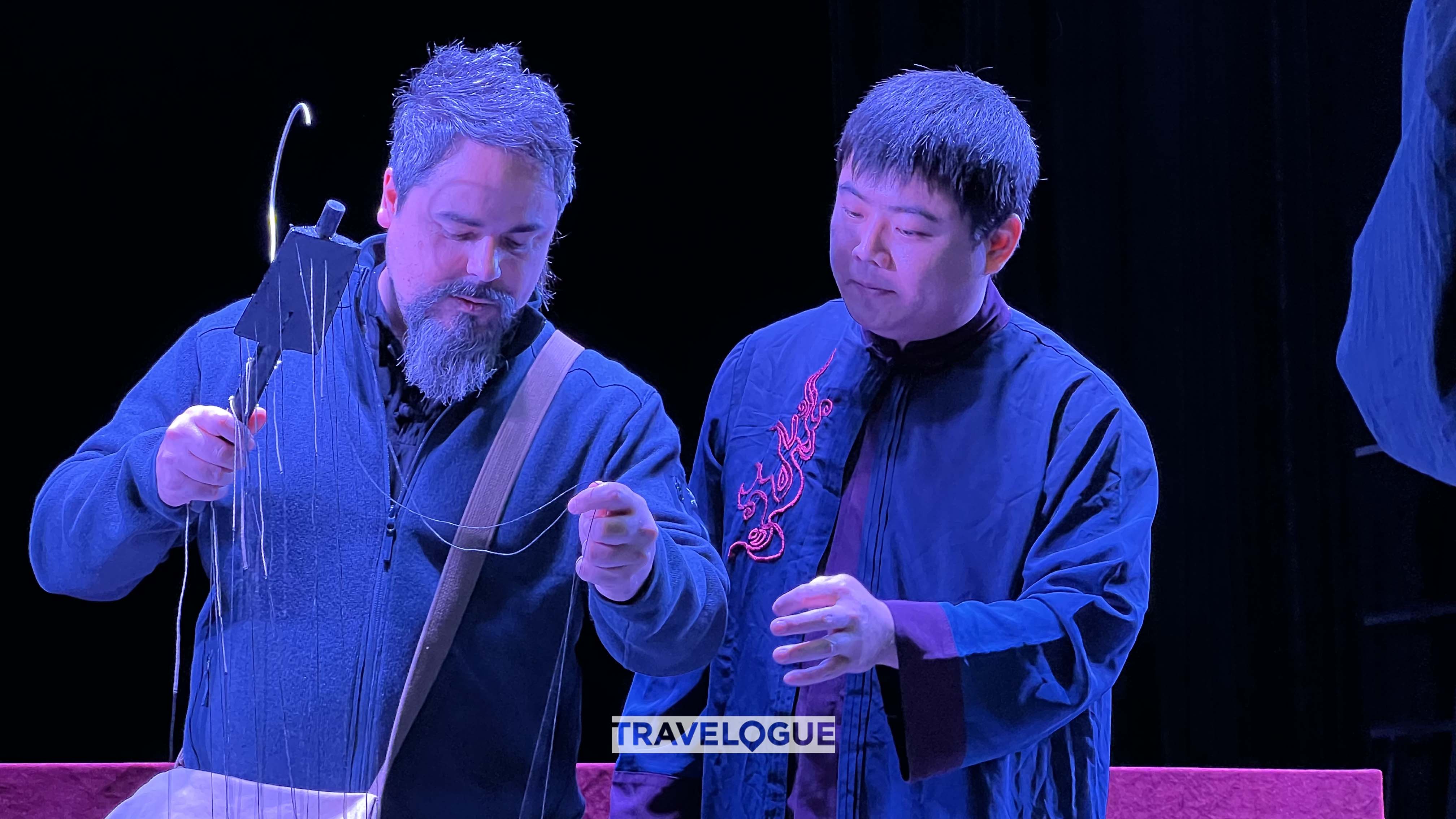 A man learns to control a puppet in Quanzhou, Fujian Province in this undated photo. /CGTN