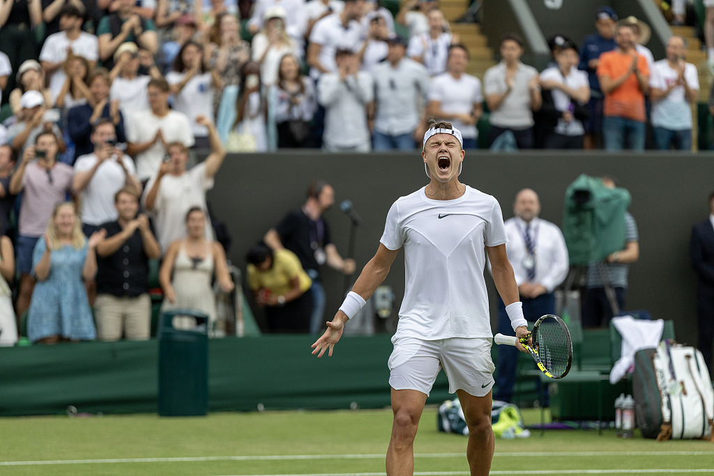 Holger Rune of Denmark celebrates his fifth-set tie-break victory against Alejandro Davidovich Fokina of Spain (not picture) after their match at the Wimbledon tennis championships in London, England, July 8, 2023. /CFP