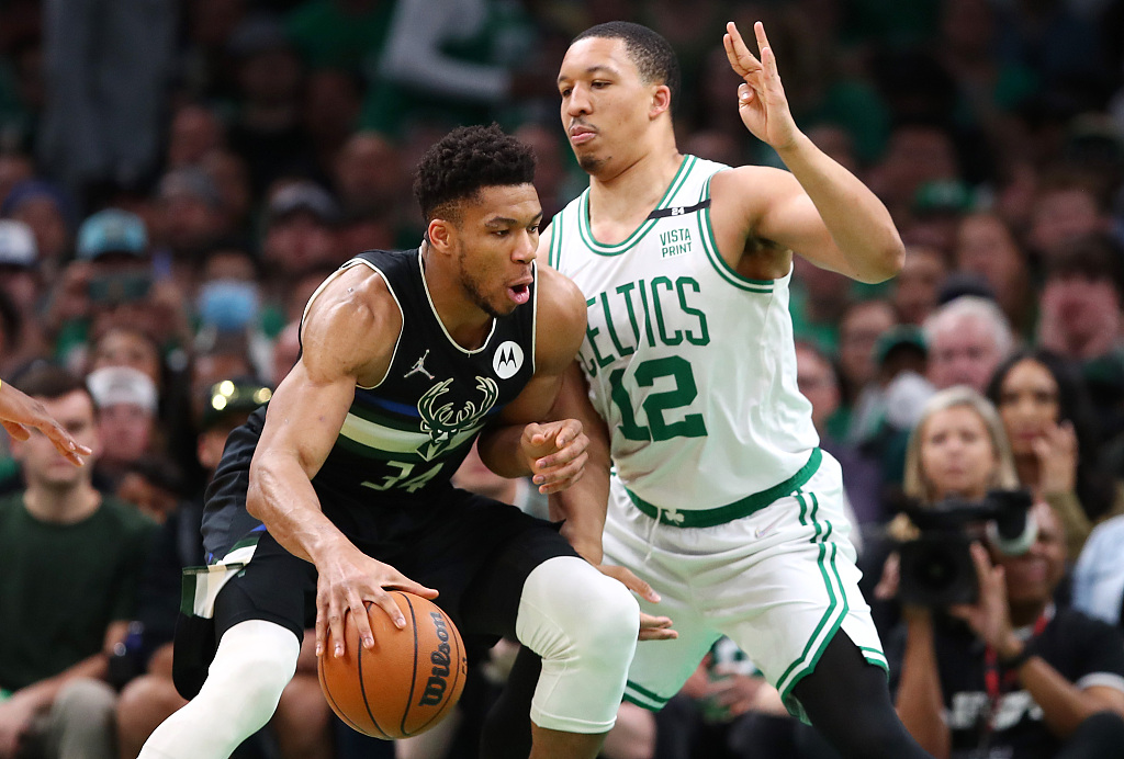 Grant Williams (#12) of the boston Celtics guards Giannis Antetokounmpo of the Milwaukee Bucks in Game 7 of the NBA Eastern Conference semifinals at TD Garden in Boston, Massachusetts, May 15, 2022. /CFP