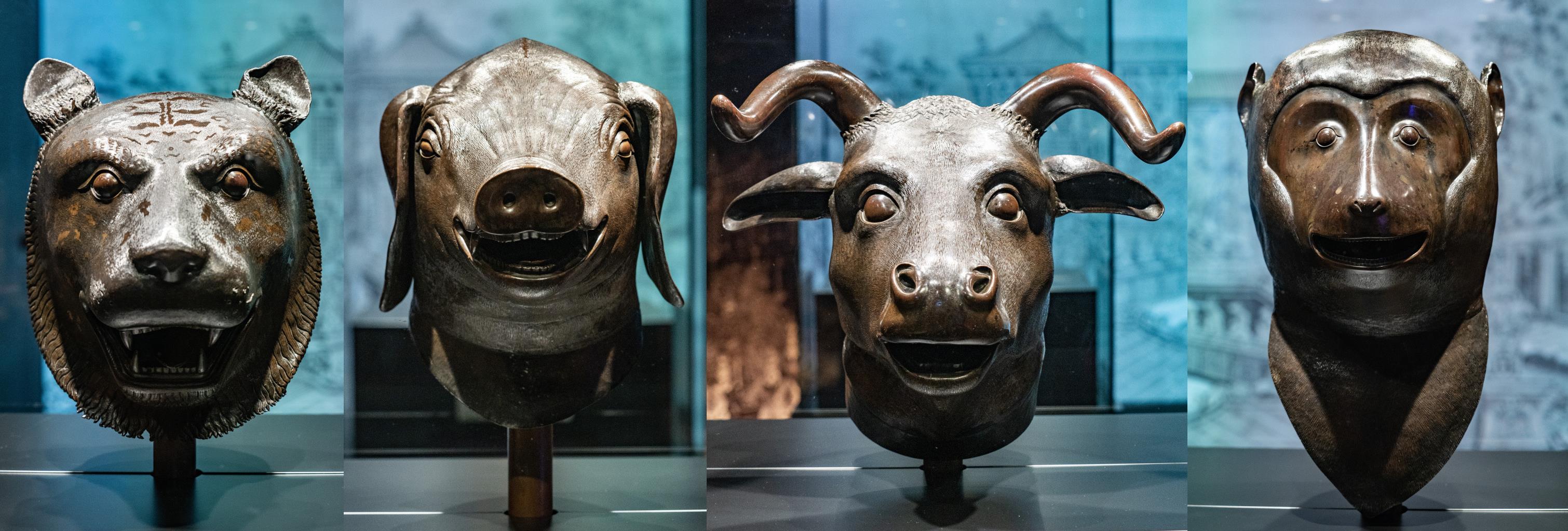 A four-picture combo shows the four bronze zodiac heads of the Tiger, Pig, Ox and Monkey (from left to right) on display at the City University of Hong Kong. /CFP