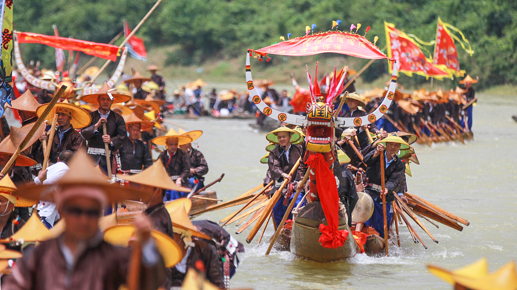 This photo taken on June 22, 2022, shows Miao villagers taking part in Canoe Dragon Boat races on the Qingshui River in southwest China's Guizhou Province. /CFP