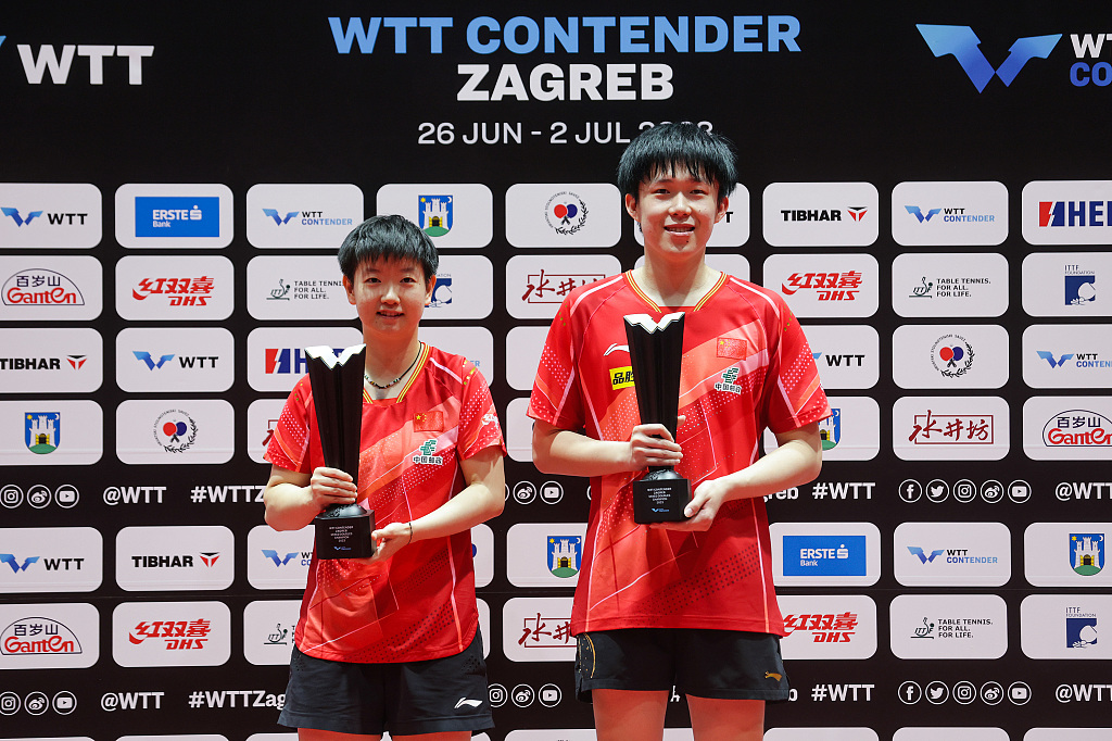 Sun Yingsha (L) and Wang Chuqin of China hold their trophies after winning the mixed doubles title during the World Table Tennis Contender Zagreb event in Zagreb, Croatia, July 1, 2023. /CFP