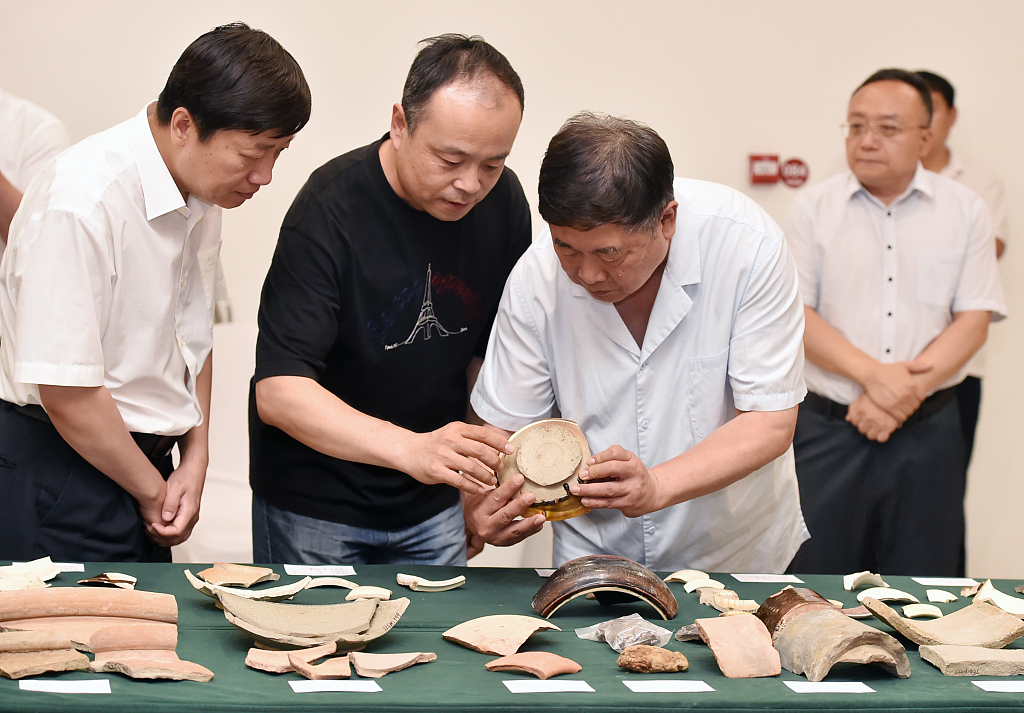 Experts from the profession check on the artifacts discovered at the Hengshui section of the Grand Canal, located in Hengshui, Hebei Province. July 8, 2023. /CFP