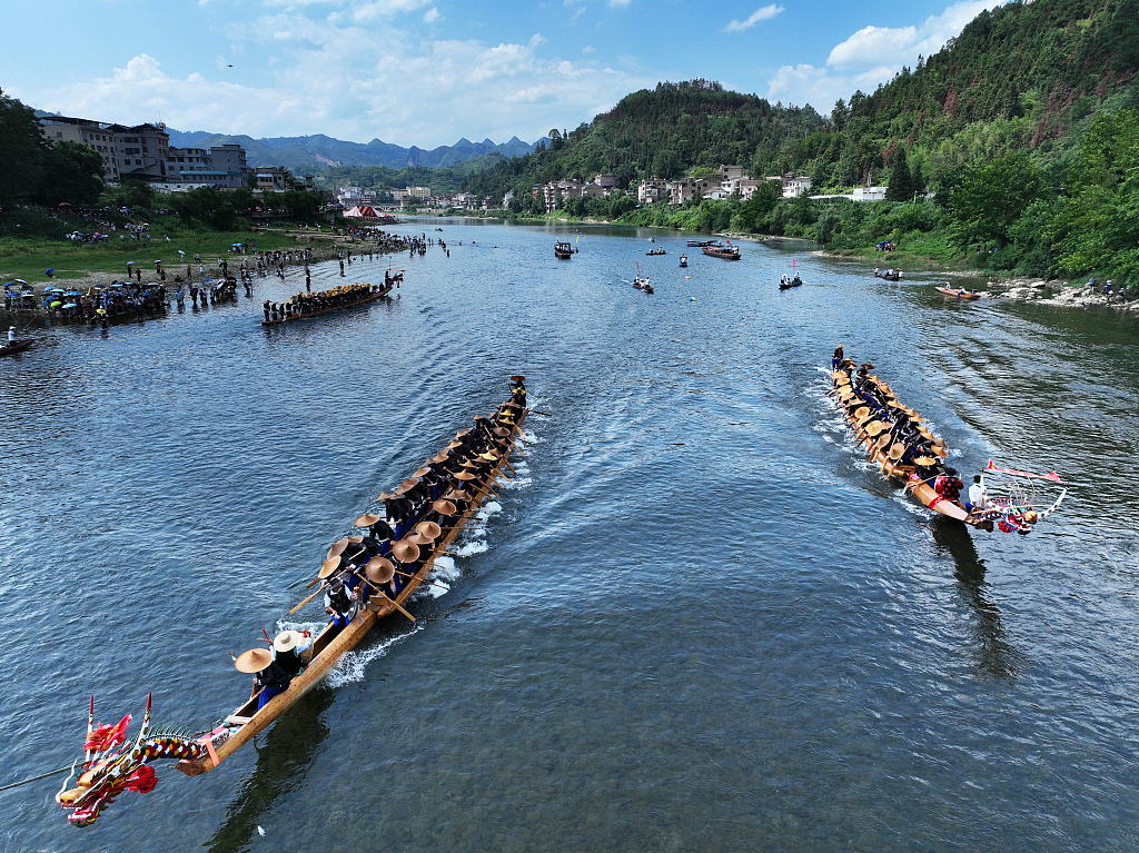 Photo taken on July 22, 2023 shows the Miao ethnic group celebrating the Canoe Dragon Boat Festival in Shidong Town, Taijiang County, Guizhou. /CFP