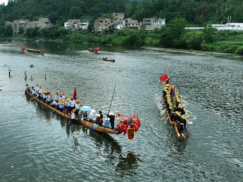 Photo taken on July 22, 2023 shows the Miao ethnic group celebrating the Canoe Dragon Boat Festival in Shidong Town, Taijiang County, Guizhou. /CFP
