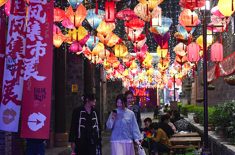 People visit a night market at the Wanshou Palace Historical and Cultural Block in Nanchang, Jiangxi Province. /CFP