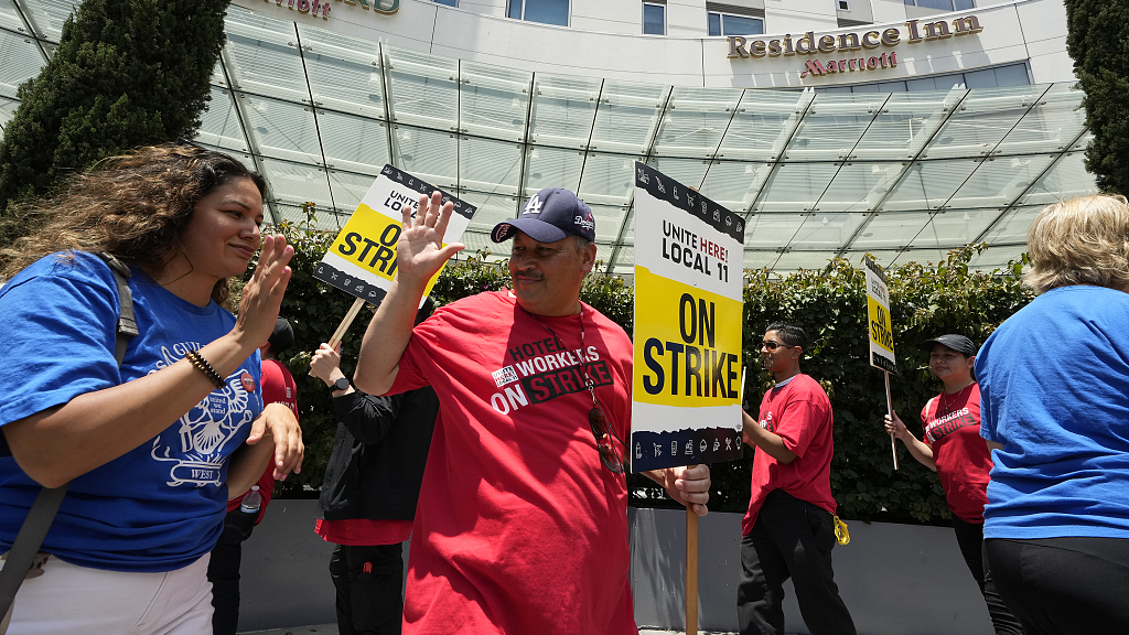 Hollywood writers wearing blue shirts support the striking hotel workers at a rally in Los Angeles, California, U.S., July 3, 2023. /CFP