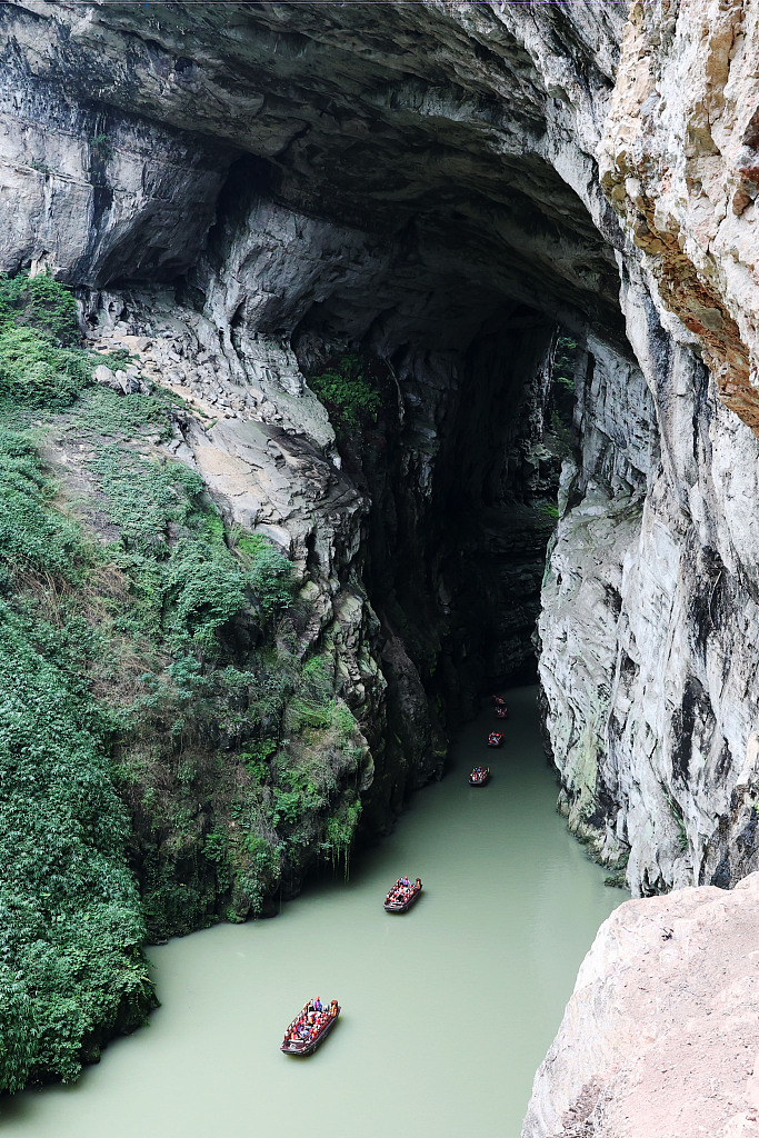 This photo taken on July 13, 2023 shows that people embarked on boat ride through Puhua River in Chongqing. /CFP