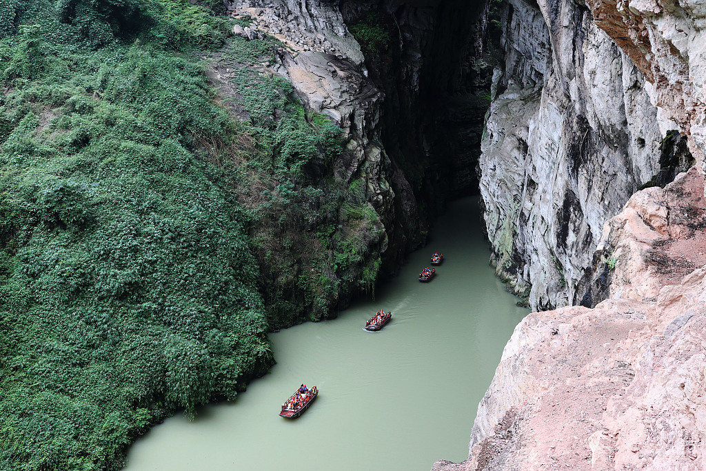 This photo taken on July 13, 2023 shows that people embarked on boat ride through Puhua River in Chongqing. /CFP