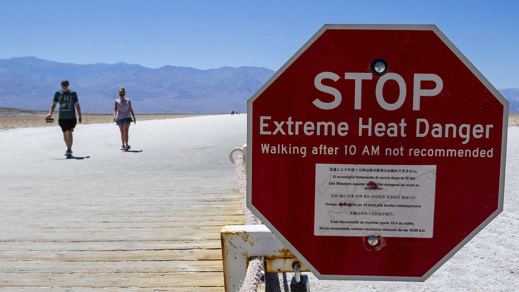 A sign warns people of extreme heat in multiple languages in Death Valley National Park, California, U.S., July 11, 2023. /CFP