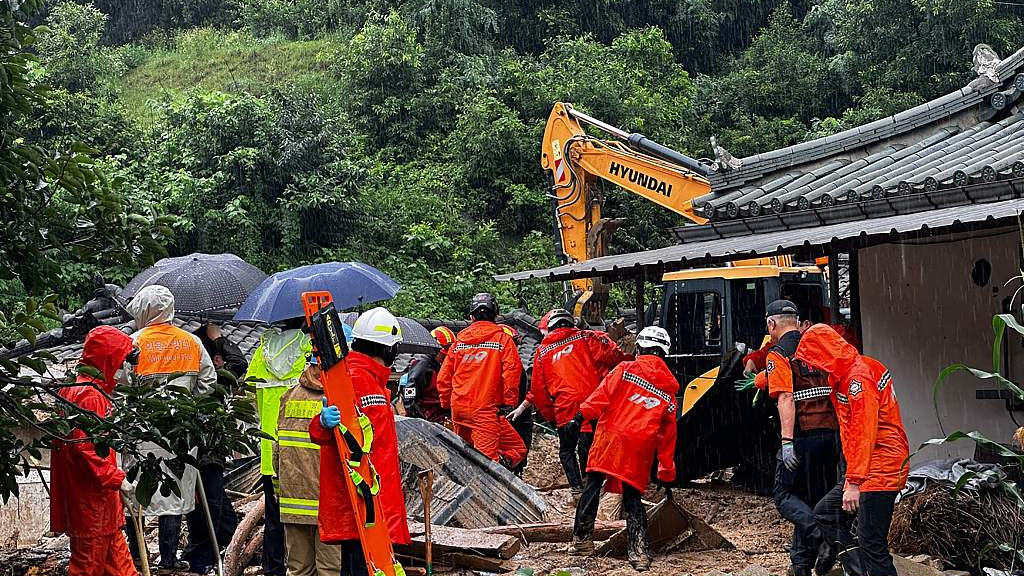 South Korean emergency workers searching for survivors at a house destroyed by flood waters after heavy rain in Yeongju, South Korea, July 15, 2023. /CFP