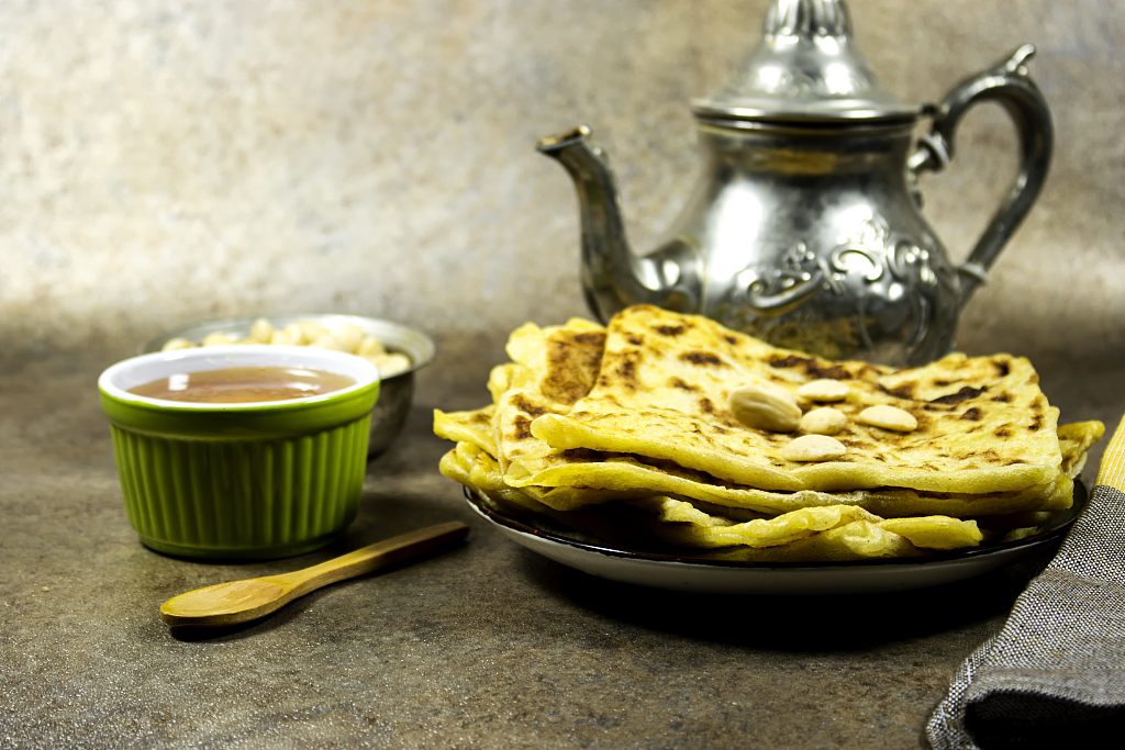 An undated photo shows a traditional layered flatbread called 