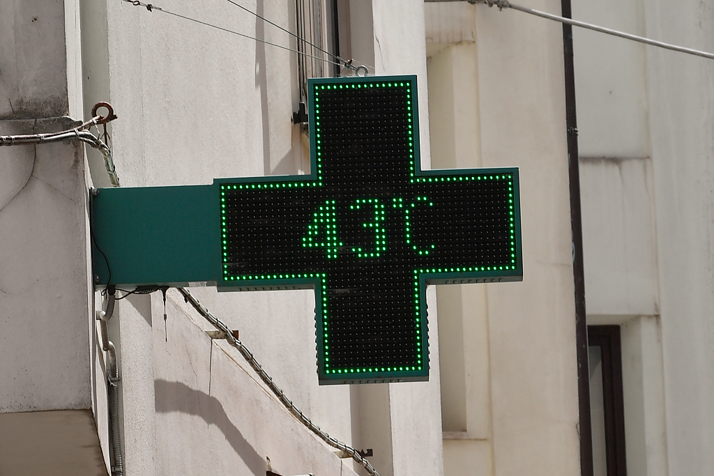 The thermometer on a pharmacy sign reads 43 degrees celsius in Sardinia, Italy on July 11, 2023. /VCG