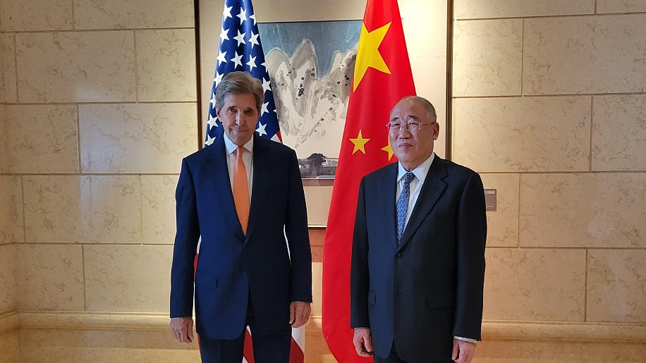 Xie Zhenhua (right), China's special envoy for climate change, greets U.S. Presidential Special Envoy for Climate John Kerry (left) ahead of talks in Beijing, China, July 17, 2023. /CFP