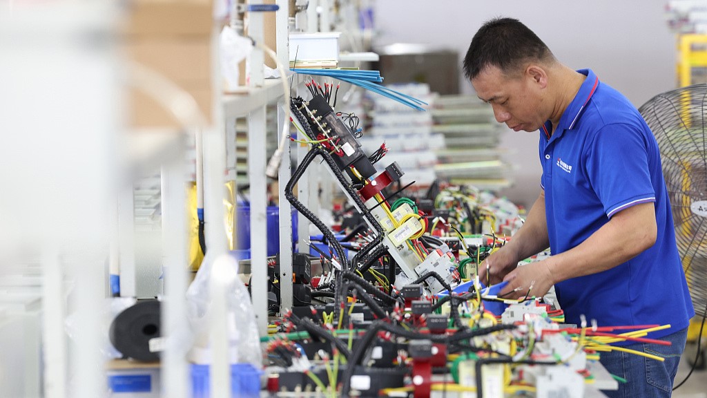 A staff working on a communication equipment manufacturing plant in southeast China's Fujian Province, July 17, 2023. /CFP