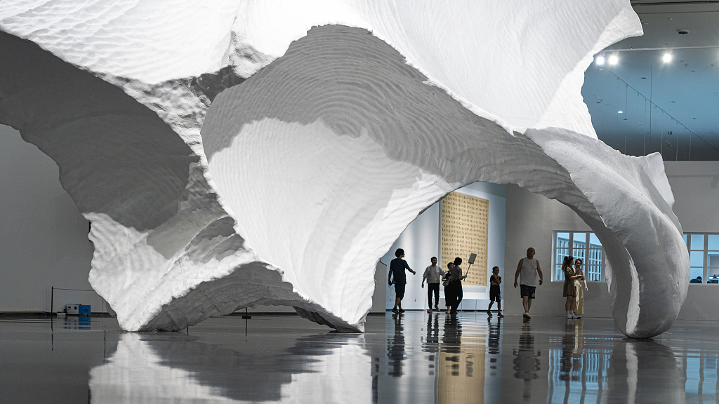 This photo taken on July 18, 2023 shows visitors walking among the exhibits at the 2023 Chengdu Biennale at the Chengdu Art Museum in Sichuan, China. /CFP