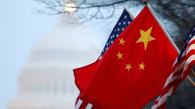 The flags of the People's Republic of China and the U.S. fly along Pennsylvania Avenue near the U.S. Capitol in Washington, D.C., U.S. January 18, 2011. /Xinhua