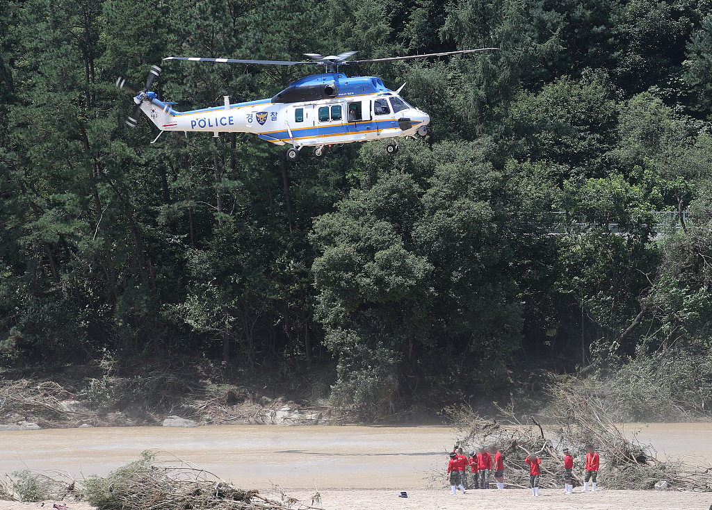A police helicopter participates in the search for a missing seaman who was washed away by flood waters, Yecheon, Gyeongsangbuk-do, South Korea, July 19, 2023. /CFP