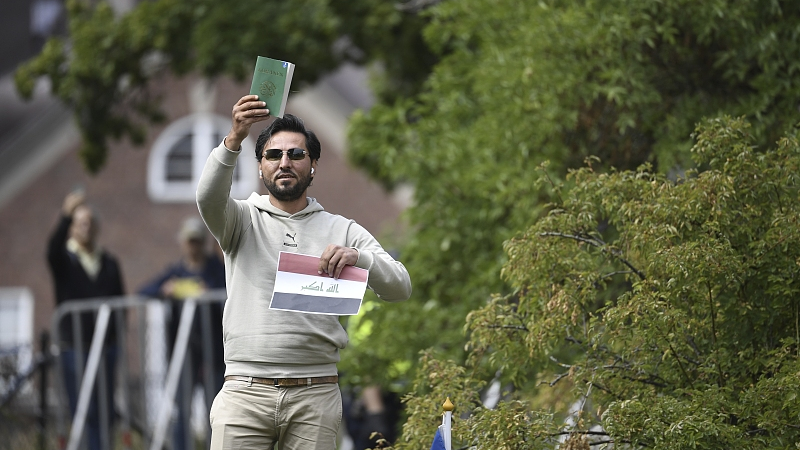 A protestor outside the Iraqi embassy in Stockholm where he plans to burn a copy of the Quran and the Iraqi flag, July 20, 2023. /CFP 