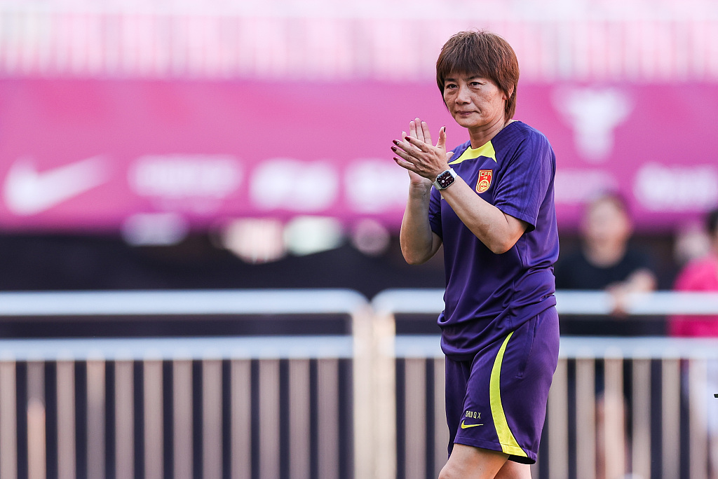 China head coach Shui Qingxia warms up during a training session in Qingdao, China, July 5, 2023. /CFP