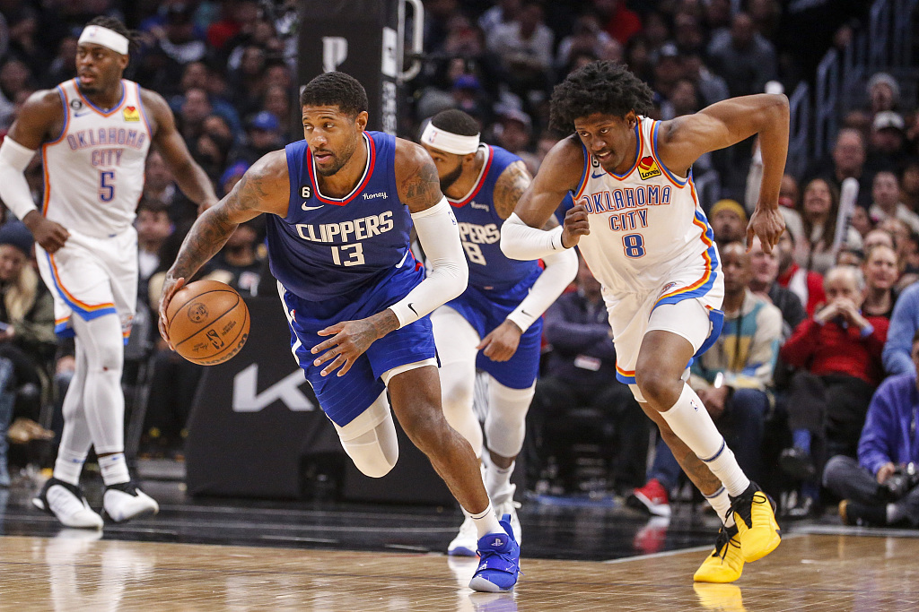 Paul George (#13) of the Los Angeles Clippers drives in the game against the Oklahoma City Thunder at Crypto.com Arena in Los Angeles, California, March 21, 2023. /CFP