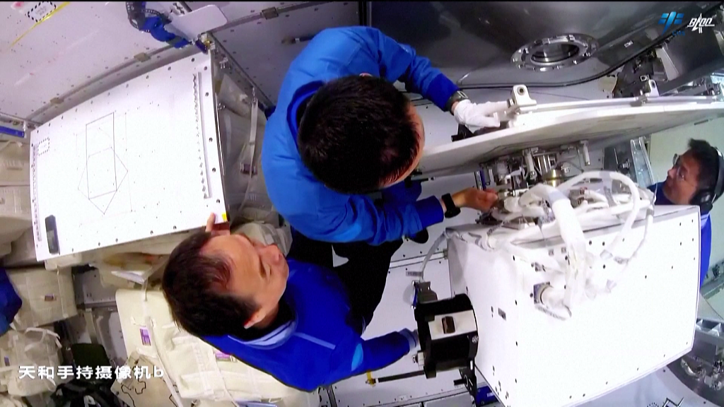 The Shenzhou-16 crew installs equipment for scientific experiments in the China Space Station. /China Manned Space Agency