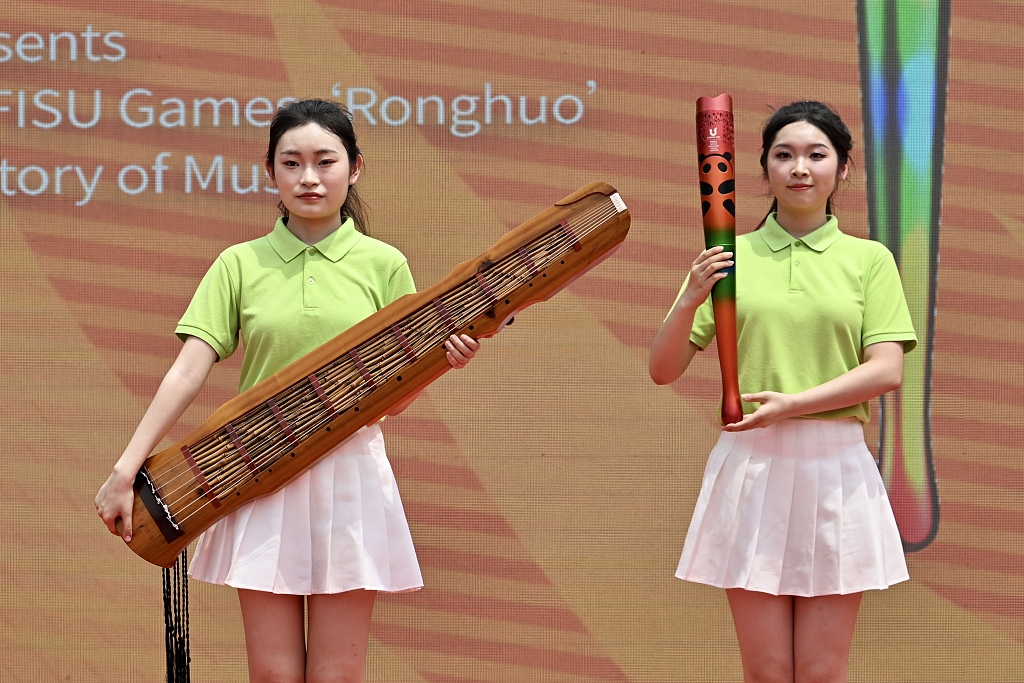The torch of the Chengdu Universiade is demonstrated during the torch relay in Chengdu, southwest China's Sichuan Province, July 20, 2023. /CFP