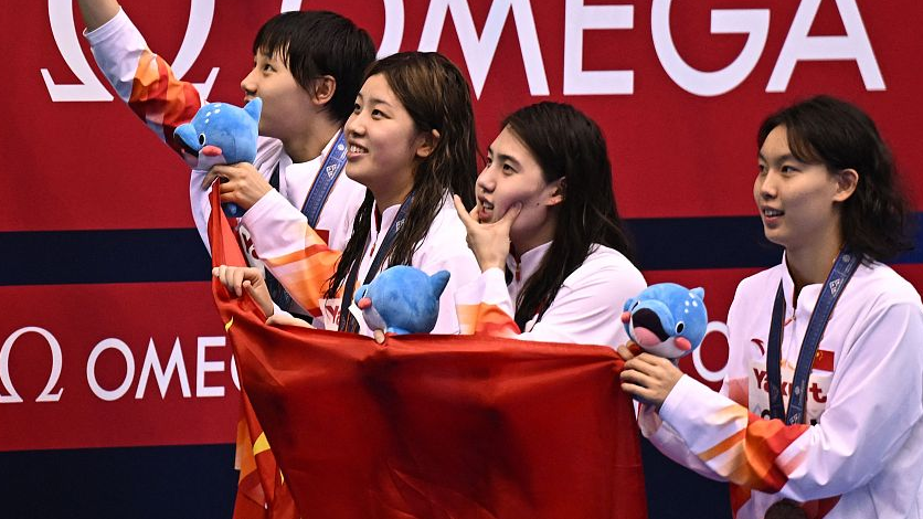Team China celebrate after winning women's 4x100m freestyle relay bronze at the World Aquatics Championships in Fukuoka, Japan, July 23, 2023. /CFP