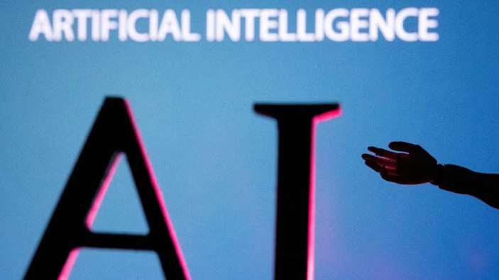 AI letters and robot hand miniature are shown in this illustration, June 23, 2023. /Reuters