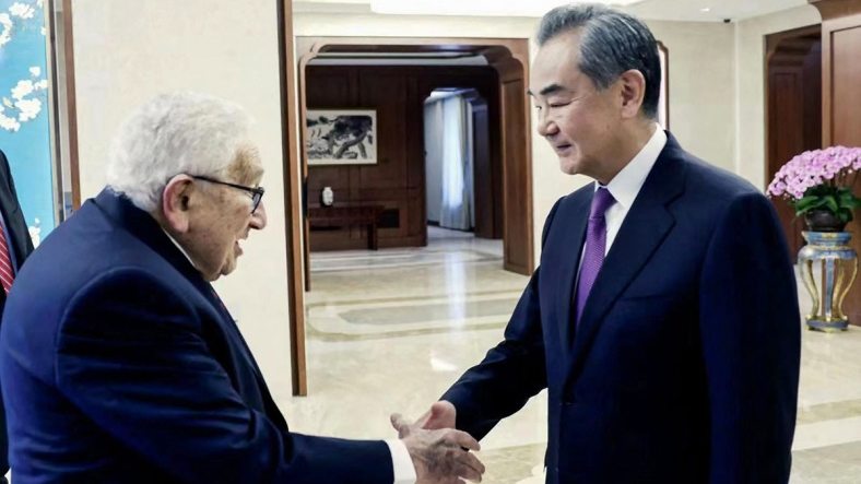 Wang Yi, a member of the Political Bureau of the Communist Party of China (CPC) Central Committee and director of the Office of the Foreign Affairs Commission of the CPC Central Committee, shakes hands with visiting centenarian former U.S. Secretary of State Henry Kissinger as they meet in Beijing, July 19, 2023. /CFP