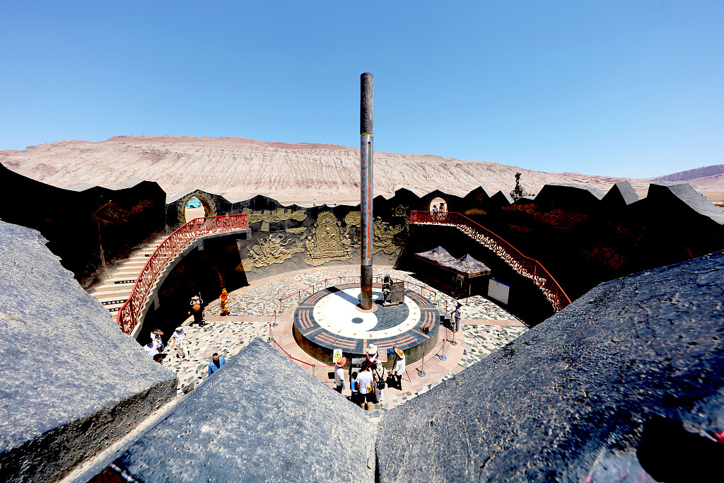 A thermometer shows that the surface temperature reached 70 degrees Celsius on Flame Mountain in Turpan, northwest China's Xinjiang Uygur Autonomous Region, June 17, 2023. /CFP