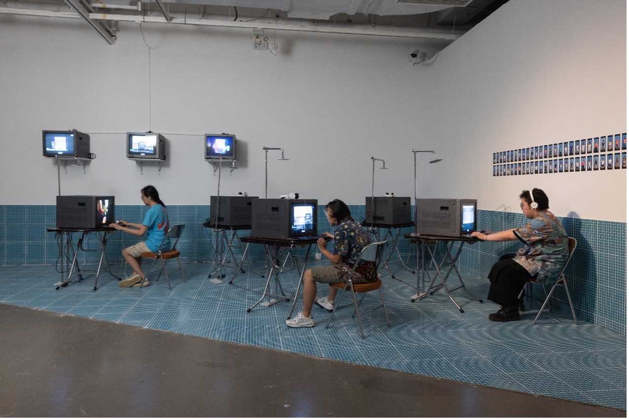 Visitors play retro video games at the Today Art Museum's art and technology themed biennial in Beijing, which opened on July 23, 2023. /CGTN