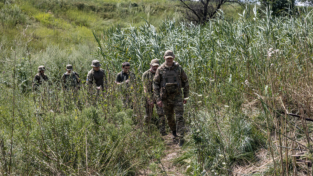 Ukrainian soldiers walk to their position on the Bakhmut frontline as Ukrainian Army conduct operation to target trenches of Russian forces through the Donetsk Oblast amid Russia-Ukraine conflict in Donetsk Oblast, Ukraine on July 24, 2023. /CFP