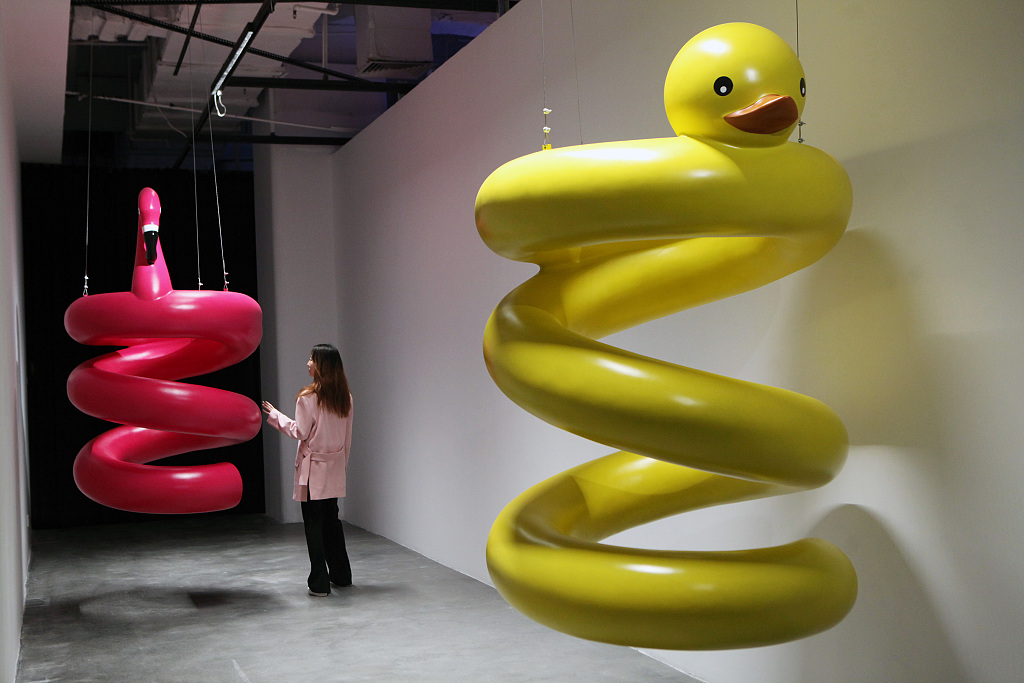 This photo taken on April 28, 2023 shows a visitor interacting with an art installation by French artist Cyril Lancelin at the K11 Art Space in Liaoning Province's Shenyang. /CFP