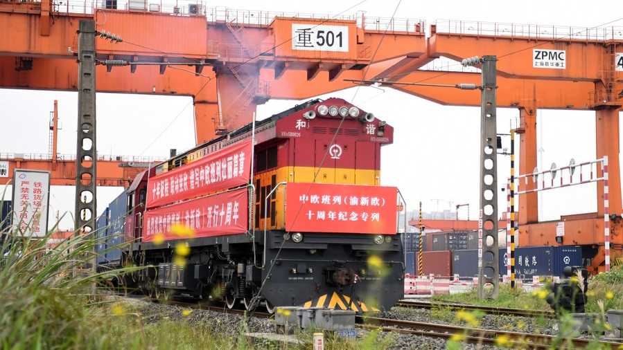 A Yuxin'ou (Chongqing-Xinjiang-Europe) China-Europe freight train leaves the Tuanjie Village Station of southwest China's Chongqing Municipality, March 19, 2021. /Xinhua