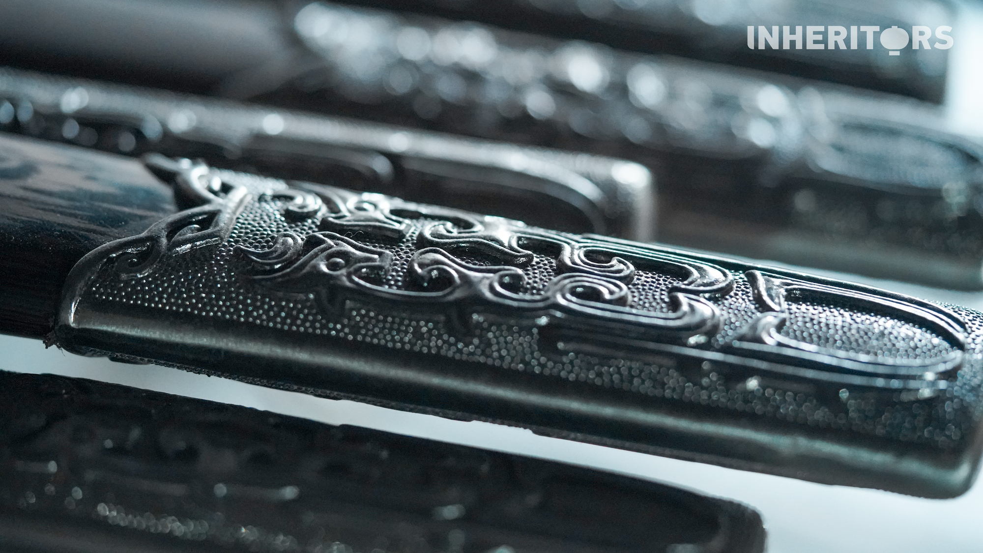 Exquisite engravings on sword hilts are seen in Longquan, east China's Zhejiang Province. /CGTN