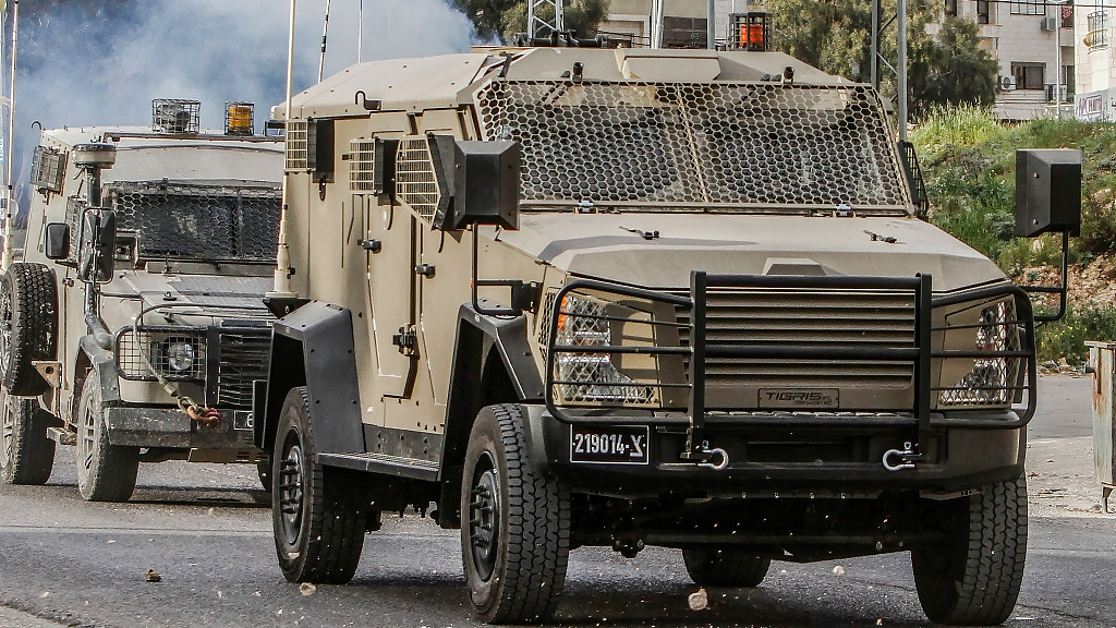Israeli military vehicles storm the Al-Ain camp for Palestinian refugees to arrest a wanted man near the city of Nablus in the occupied West Bank, July 26, 2023. /CFP