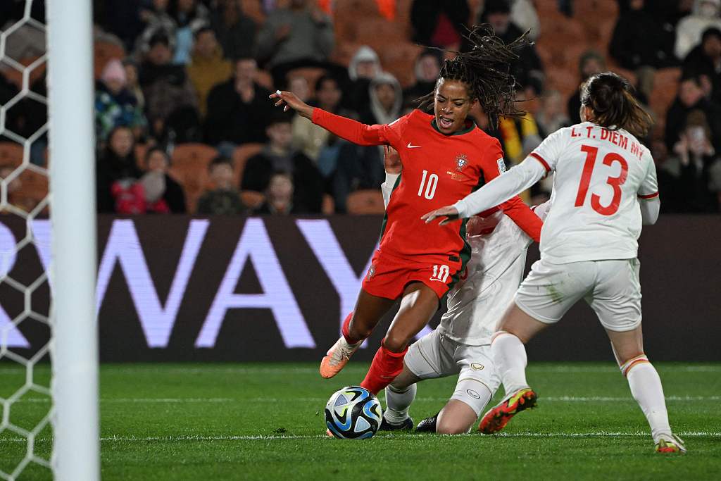 Portuguese and Vietnamese players in action during Women's World Cup group stage in Hamilton, New Zealand, July 27, 2023. /CFP